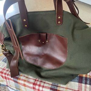 United by blue green canvas bag.